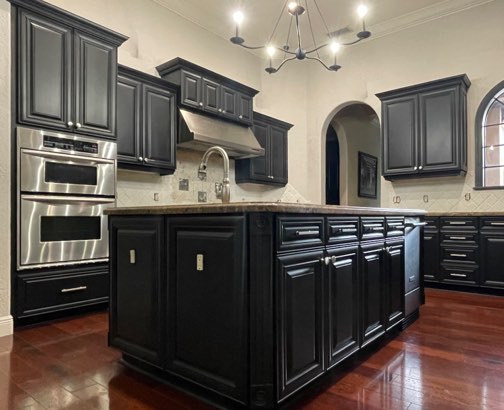 Bold black kitchen with large island
